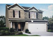 Two-story house with brick accents and a two-car garage at 417 Samara Ct, Fairburn, GA 30213