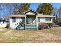Charming one-story home with a inviting front porch and classic architectural design at 1770 Rockland Se Dr, Atlanta, GA 30316