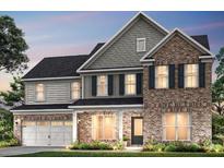 Two-story brick home with gray shake siding and a three-car garage at 5270 Birch Valley Rd, Cumming, GA 30028