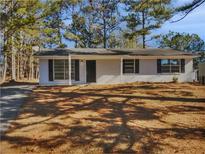 Newly renovated ranch home featuring a covered entry and spacious yard at 9129 Bent Pine Ne Ct, Covington, GA 30014
