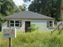 Newly constructed single-story home with gray exterior and dark brown door at 1290 Graymont Sw Dr, Atlanta, GA 30310