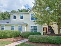 Attractive exterior of a two-story townhome with landscaping at 23 Chelsea Ct, Avondale Estates, GA 30002
