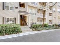 Attractive condo exterior with well-maintained landscaping and visible unit number 1000 at 1250 Parkwood Se Cir # 1004, Atlanta, GA 30339