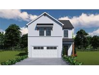 Two-story house with white siding, two-car garage, and landscaping at 4361 Portsbrook Ave, Snellville, GA 30039