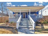 Charming home with a welcoming front porch, white railings and a cozy, inviting atmosphere at 2507 Maple St, Atlanta, GA 30344