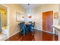 Bright dining area with hardwood floors, a table, and four chairs at 361 17Th St # 2001, Atlanta, GA 30363