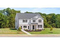 Two-story brick home with gray roof and landscaping at 625 Kimberwick Dr, Locust Grove, GA 30248