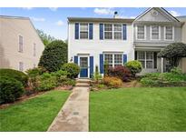 Charming townhome with well-manicured lawn and colorful landscaping at 3742 Berkeley Xing, Duluth, GA 30096