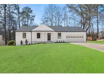 Newly renovated house with a spacious front yard at 2920 Queens Ct, Norcross, GA 30071
