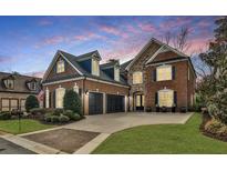 Beautiful brick home with a two-car garage, manicured lawn, and stunning curb appeal at 1250 Atherton Park, Roswell, GA 30076
