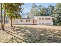 Ranch style home with large yard and mature trees at 3343 Charlemagne Dr, Decatur, GA 30034