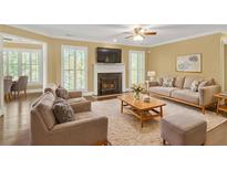 Spacious living room with fireplace and hardwood floors at 900 Camden Ct, Atlanta, GA 30327