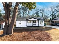 Charming craftsman style home with a front porch and mature tree at 1816 Ledo Ave, Decatur, GA 30035