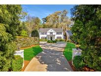 Elegant home with circular driveway and manicured lawn at 3382 Habersham Nw Rd, Atlanta, GA 30305