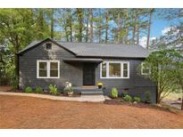 Gray-toned shingle house with a landscaped yard at 225 Amy Ne Dr, Marietta, GA 30060