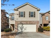 Two-story townhome with attached garage and landscaping at 116 Centennial Ridge Dr, Acworth, GA 30102