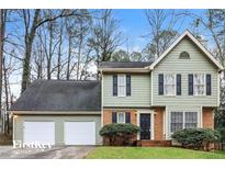 Two-story house with attached garage and landscaping at 2105 Cornerstone Sw Ln, Marietta, GA 30064