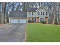 Two-story house with a three-car garage and a large front yard at 2105 Cornerstone Sw Ln, Marietta, GA 30064