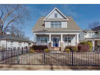 Two-story craftsman home with gray siding, brick accents, and a charming front porch at 1559 Walker Ave, College Park, GA 30337