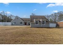 Charming single story home with light gray siding and a large front yard at 1890 Old Concord Se Dr, Covington, GA 30016