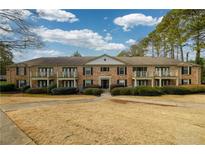 Brick building exterior with balconies and landscaping at 3650 Ashford Dunwoody Ne Rd # 514, Atlanta, GA 30319