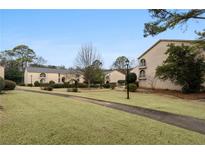 Exterior view of a well-maintained community with grassy areas and attractive buildings at 3242 Henderson Mill Rd # 3, Atlanta, GA 30341