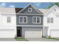 Two-story townhome with gray siding, white trim, and a two-car garage at 1149 Chastain Dr # 62, Sugar Hill, GA 30518