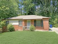 Brick ranch home with a spacious yard at 3777 Crosby Nw Dr, Atlanta, GA 30331