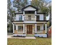 Two-story house with white siding, black accents, and a front porch at 1732 Beecher Sw St, Atlanta, GA 30310