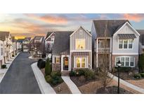 Attractive 2 story townhome with charming front porch and landscaping at 332 Symphony Se Way, Smyrna, GA 30080