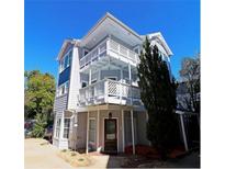 Three-story home with multiple balconies and a charming front entrance at 1036 Greenwood Ne Ave # C, Atlanta, GA 30306