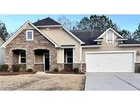 Beautiful two-story house with stone accents and a two-car garage at 3030 Parkland Vw, Atlanta, GA 30331