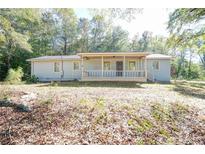 Ranch style home with covered porch at 90 Bruce Ln, Covington, GA 30014