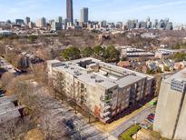Aerial view of a modern apartment building in a vibrant city setting at 384 Ralph Mcgill Ne Blvd # 404, Atlanta, GA 30312