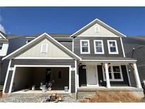 Charming new construction home with a two-car garage and inviting front porch at 110 Okeechobee Way, Braselton, GA 30548