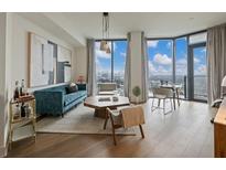 Modern living room with city views, hardwood floors, and stylish furnishings at 788 W Marietta Nw St # 1504, Atlanta, GA 30318
