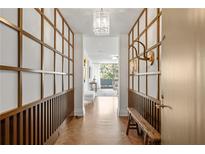Elegant entryway with wood flooring, built-in shelving, and a bench at 2575 Peachtree Ne Rd # 9G, Atlanta, GA 30305
