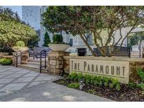 The Paramount building entrance with water feature and landscaping at 3445 Stratford Ne Rd # 2702, Atlanta, GA 30326