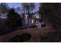 Two-story house with stone accents and a wraparound porch at 121 Rachel Blvd, Temple, GA 30179