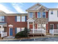 Two-story brick townhouse with a front porch and landscaping at 3607 Ginnis Sw Dr # 7, Atlanta, GA 30331