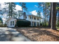 Ranch style home with a large backyard and mature trees at 9935 La View Cir, Roswell, GA 30075