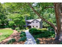 Two-story home with landscaped yard and walkway at 5236 Weatherwood Trce, Marietta, GA 30068