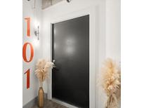 Modern entryway with black door and unique wall art at 1065 United Se Ave # 101, Atlanta, GA 30316