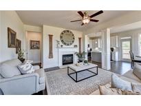 Spacious living room features a cozy fireplace and large windows at 1934 Asher Ln # 060, Conyers, GA 30013