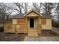 Newly renovated cottage with a fresh coat of paint and new deck at 2064 Chicago Nw Ave, Atlanta, GA 30314