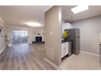Open concept kitchen and living room with stainless steel appliances and fireplace at 970 Sidney Marcus Ne Blvd # 2113, Atlanta, GA 30324