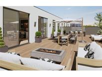 Spacious rooftop deck with fire pit, outdoor kitchen, and ample seating at 318 Sandy Springs Cir # 250, Sandy Springs, GA 30328