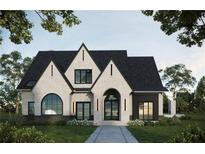 Stunning two-story home with a brick facade, black roof, and arched entryway at 381 Canton St, Alpharetta, GA 30009