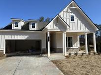 Two-story house with white siding, gray roof, and a covered front porch at 1109 Cooks Farm Way, Woodstock, GA 30189