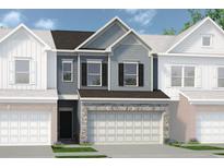 Two-story townhome with gray siding, stone accents, and a two-car garage at 2660 Ravencliff Dr # 167, Austell, GA 30168